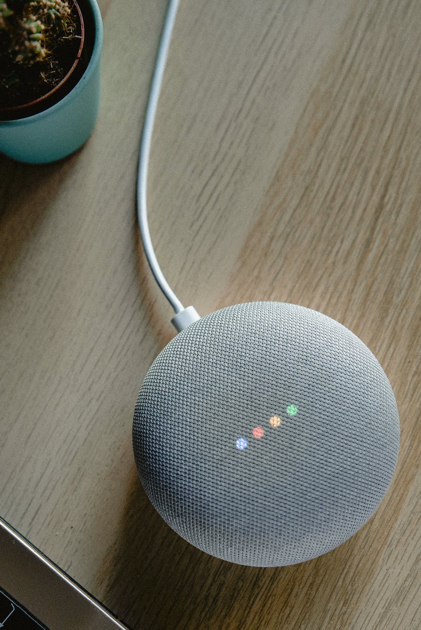 portable speaker on brown wooden table